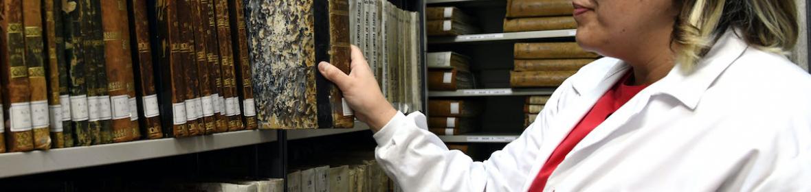 Woman in an archive
